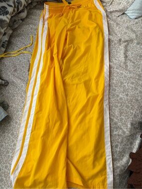 Yellow Track Pants with White Side Stripes